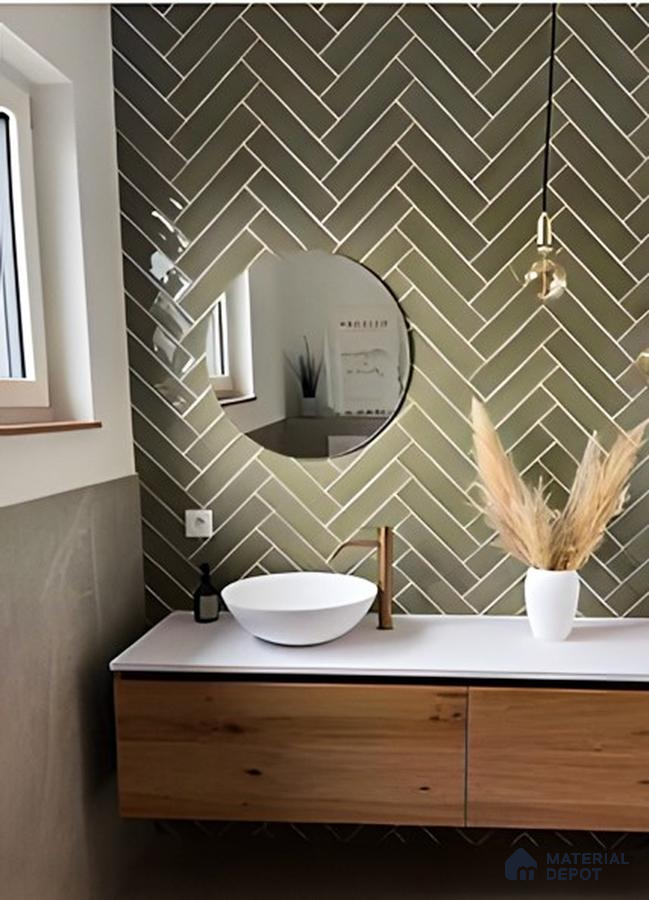 Chic Minimalist Bathroom Featuring Soft Green Herringbone Tiles and Natural Wood | Material Depot