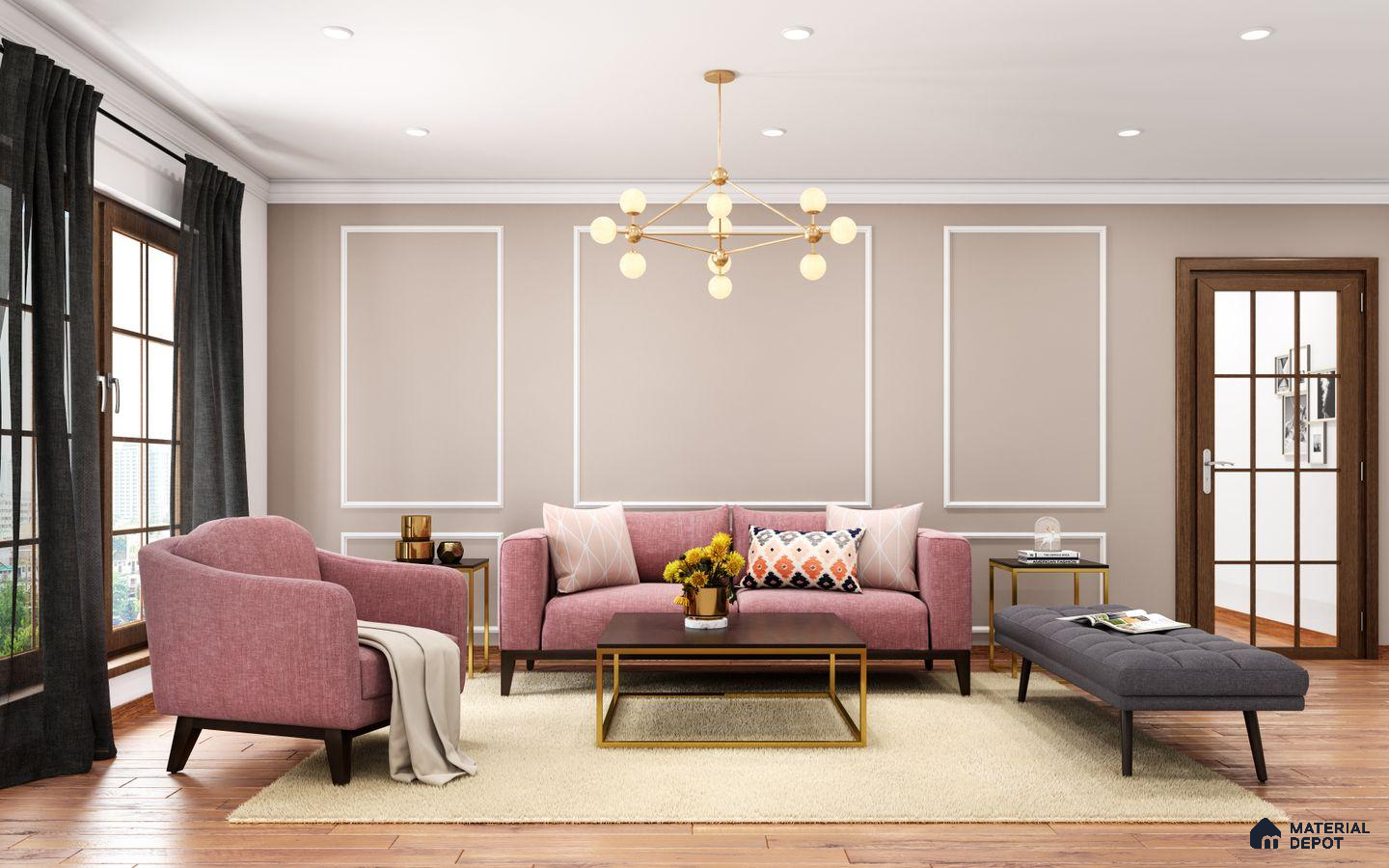 A spacious modern living room featuring a stylish pink sofa with designed and printed cushions, a white rectangular design on the wall, wooden windows, soft pastel walls, and hanging pendants. Black curtains add a touch of sophistication to the chic decor.