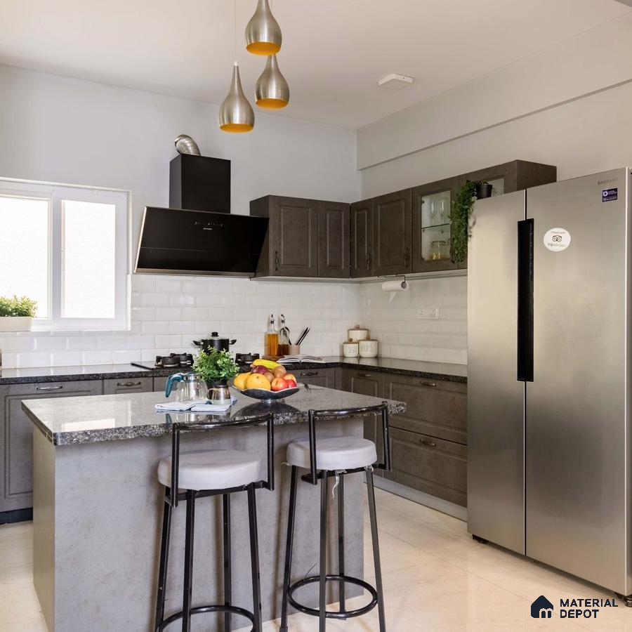 Modern 3 BHK villa in Bangalore showcasing a spacious blue living room and a beautiful kitchen with a double-door fridge, a sunlit window, and a sleek black chimney, epitomizing style and convenience.