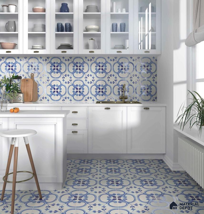 Blue designed tiles with white laminate and faucet