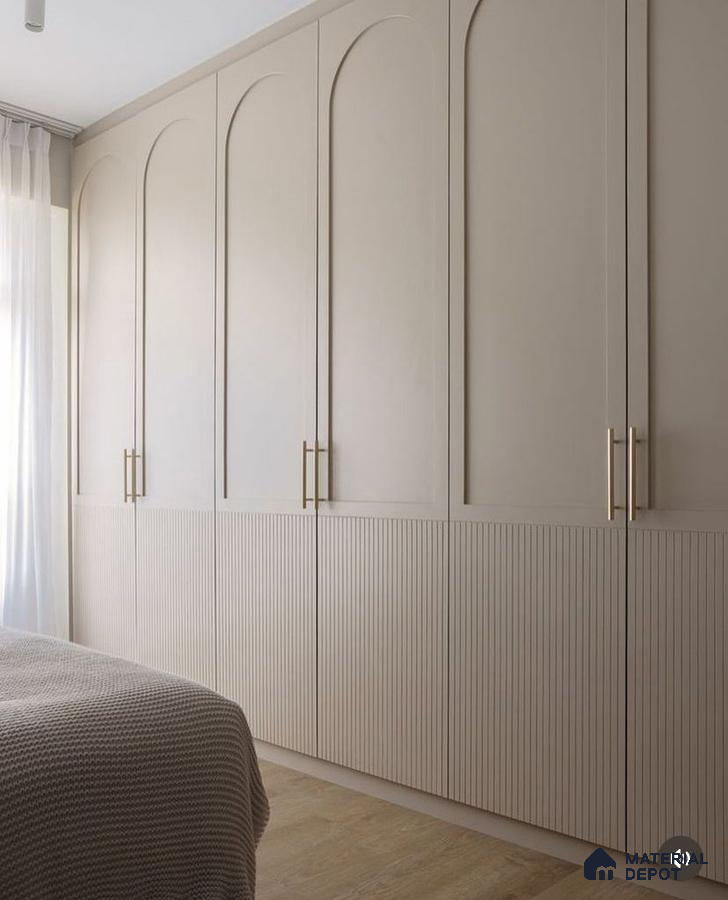 Minimalist bedroom with beige solid color and fluted laminate wardrobe and light wood flooring | Material Depot