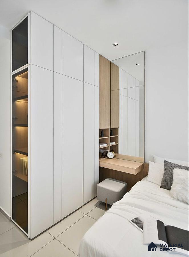 Minimalist bedroom with frosty white laminate wardrobe, light oak laminate study desk, and large wall mirror | Material Depot