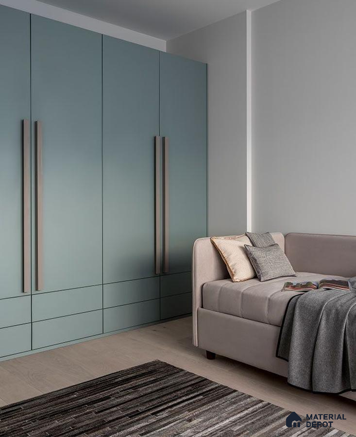 Minimalist bedroom with pastel green solid color laminate wardrobe and light wood flooring | Material Depot