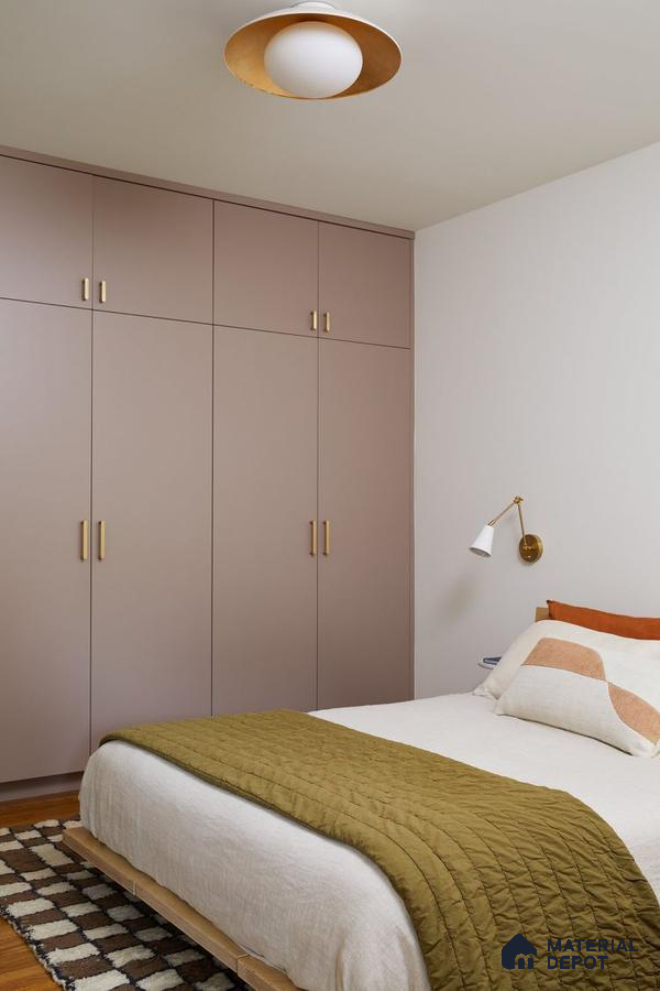 Minimalist bedroom with taupe matte laminate wardrobe and light wood bed frame | Material Depot