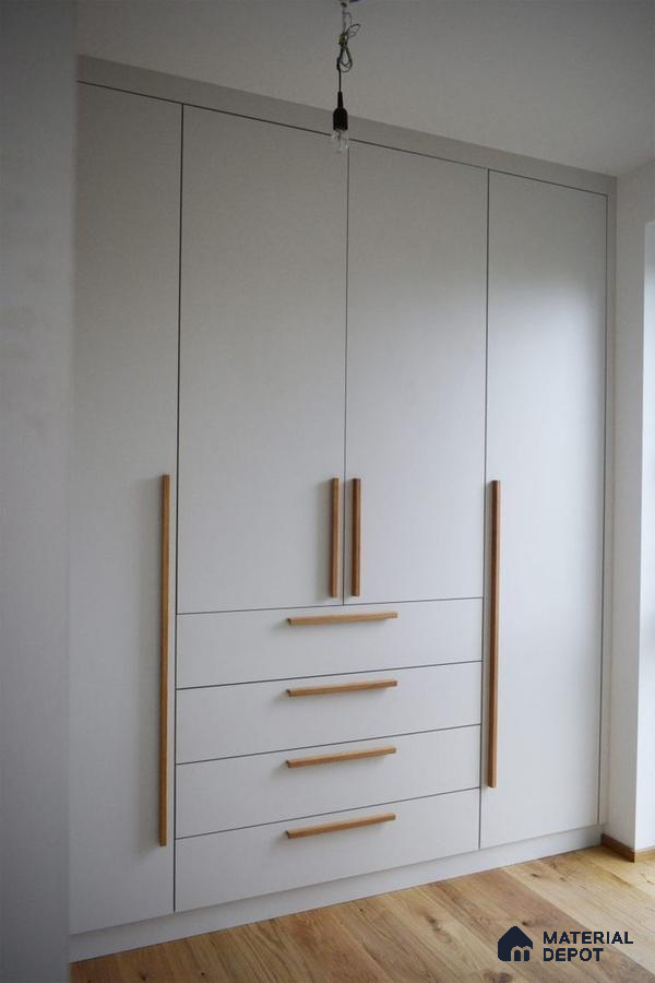 Minimalist wardrobe with frosty white laminate and natural oak handles on wooden flooring | Material Depot