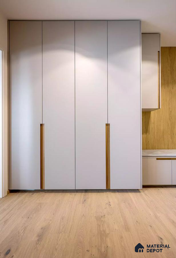 Minimalist wardrobe with frosty white laminate shutters and natural oak wooden flooring | Material Depot