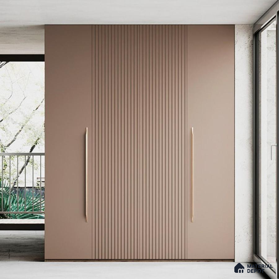 Minimalist wardrobe with matte taupe fluted laminate shutters and long gold handles | Material Depot