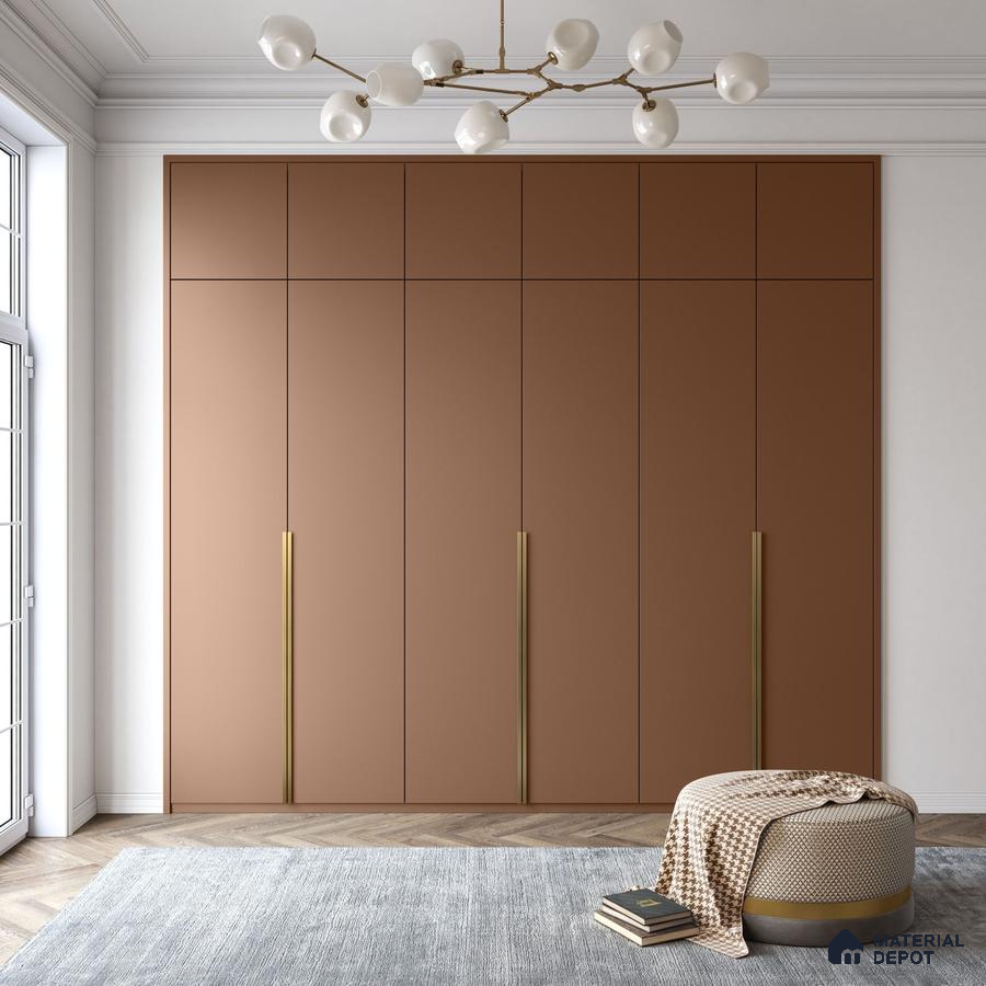 Minimalist wardrobe with matte terracotta laminate shutters and brass handles on herringbone wood flooring | Material Depot