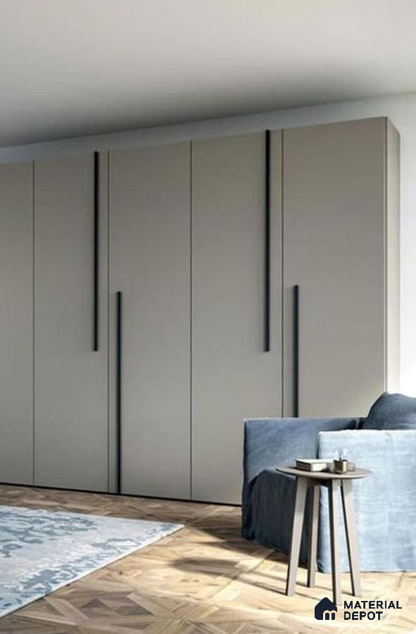 Minimalist wardrobe with taupe matte laminate shutters and herringbone wood flooring | Material Depot
