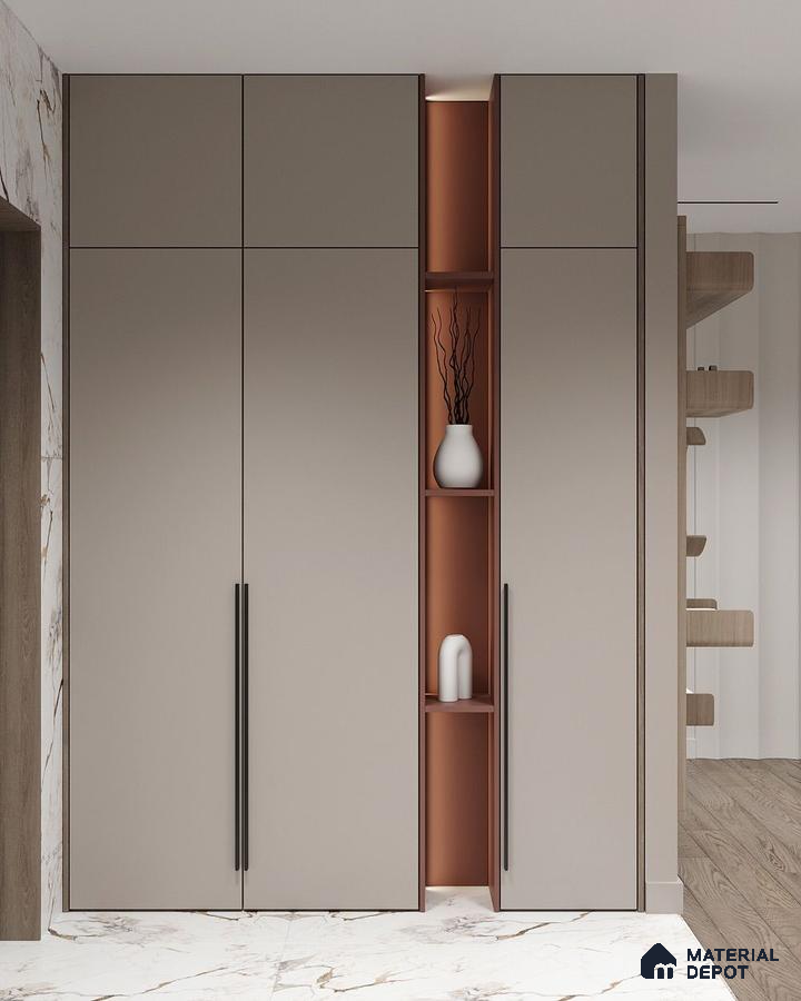 Minimalist wardrobe with taupe matte laminate shutters and terracotta open shelving on marble floor | Material Depot