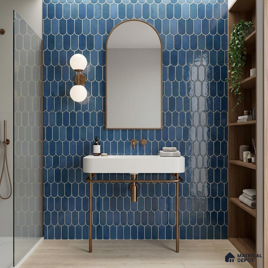 Modern bathroom with blue fishscale wall tiles and light wood floor