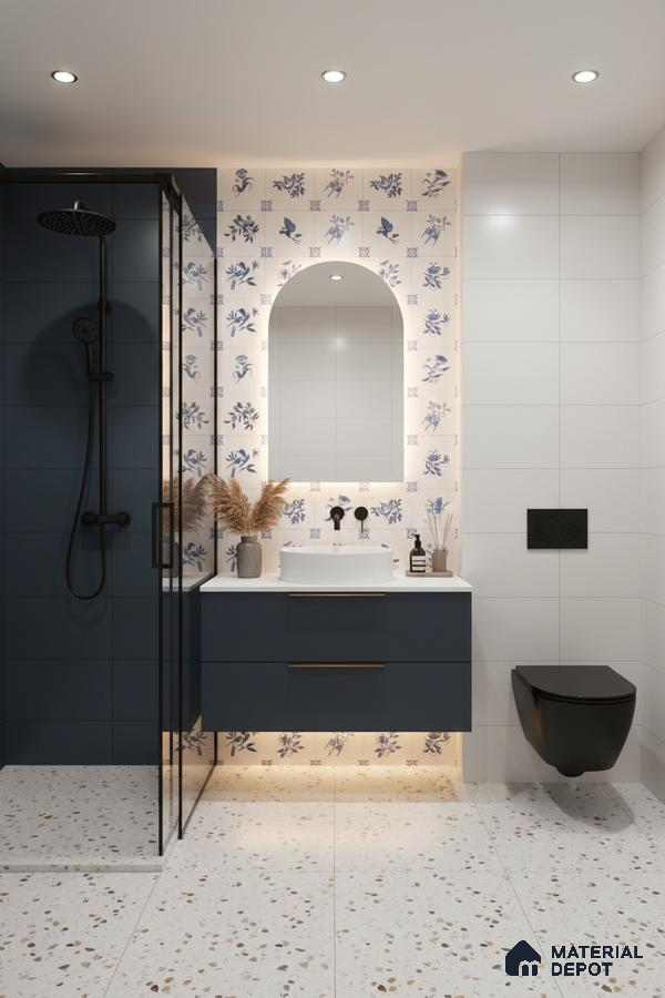 Modern bathroom with blue floral accent wall tiles, terrazzo floor tiles, and navy vanity in Bengaluru | Material Depot