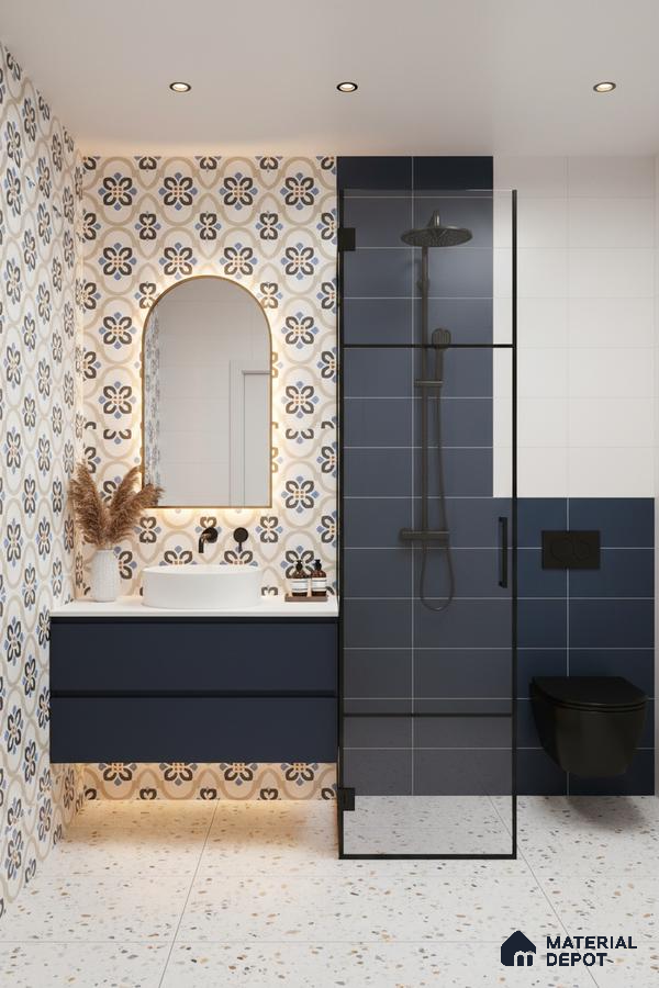 Modern bathroom with blue geometric floral wall tiles, navy blue subway tiles, and terrazzo floor tiles in Bengaluru | Material Depot