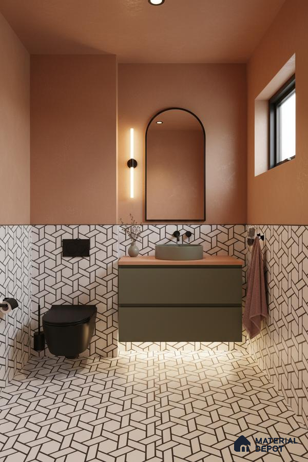 Modern bathroom with geometric black-and-white wall and floor tiles, olive green vanity, and terracotta wall paint in Bengaluru | Material Depot