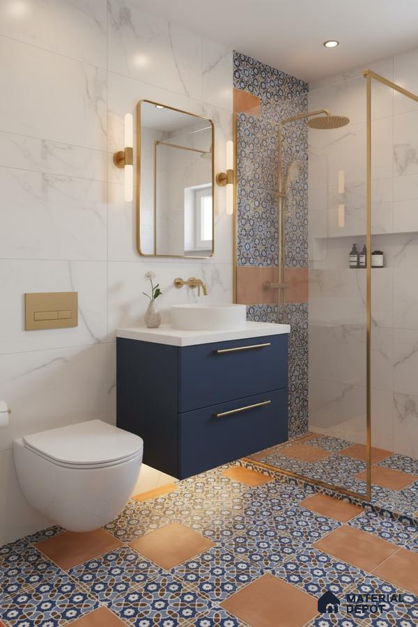 Modern bathroom with marble wall tiles, blue and terracotta patterned floor tiles, and gold accents in Bengaluru | Material Depot