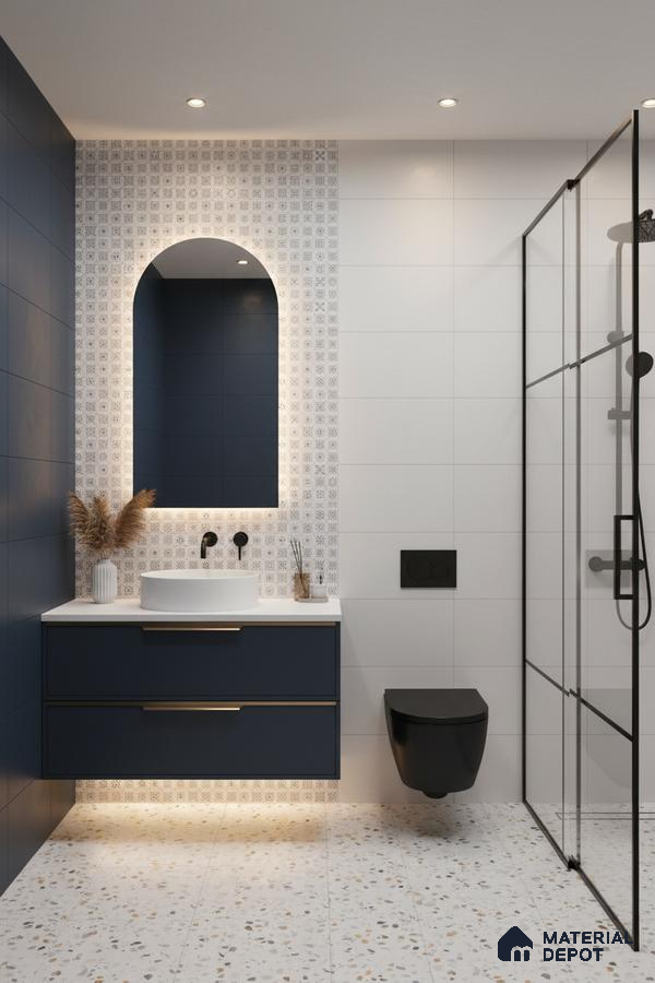 Modern bathroom with navy blue vanity, terrazzo floor tiles, and patterned accent wall tiles in Bengaluru | Material Depot
