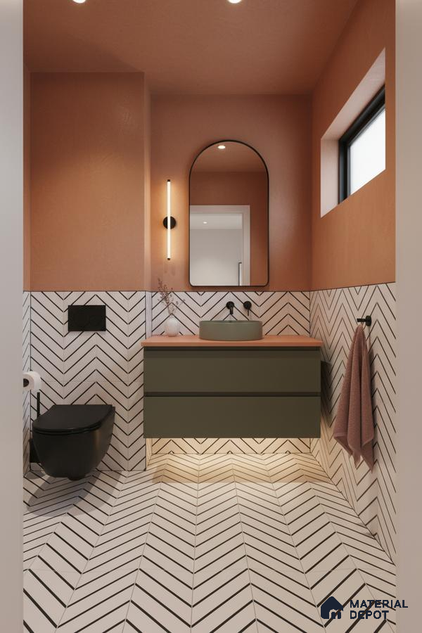 Modern bathroom with olive green vanity, terracotta paint, and chevron patterned white wall and floor tiles in Bengaluru | Material Depot