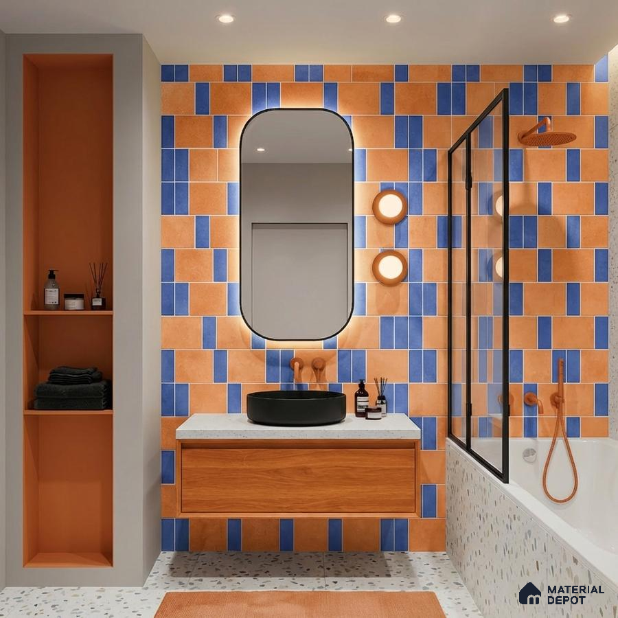 Modern bathroom with orange and blue geometric wall tiles, terrazzo floor, and wood vanity