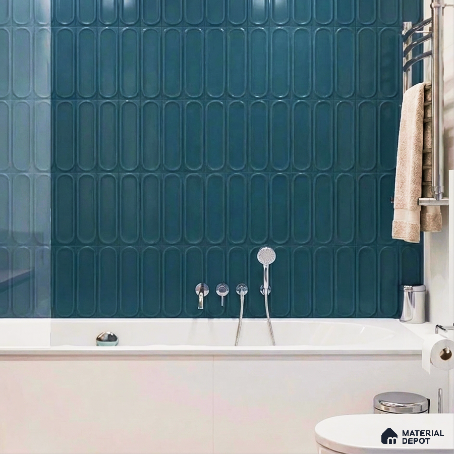 Modern bathroom with teal elongated subway wall tiles and white bathtub