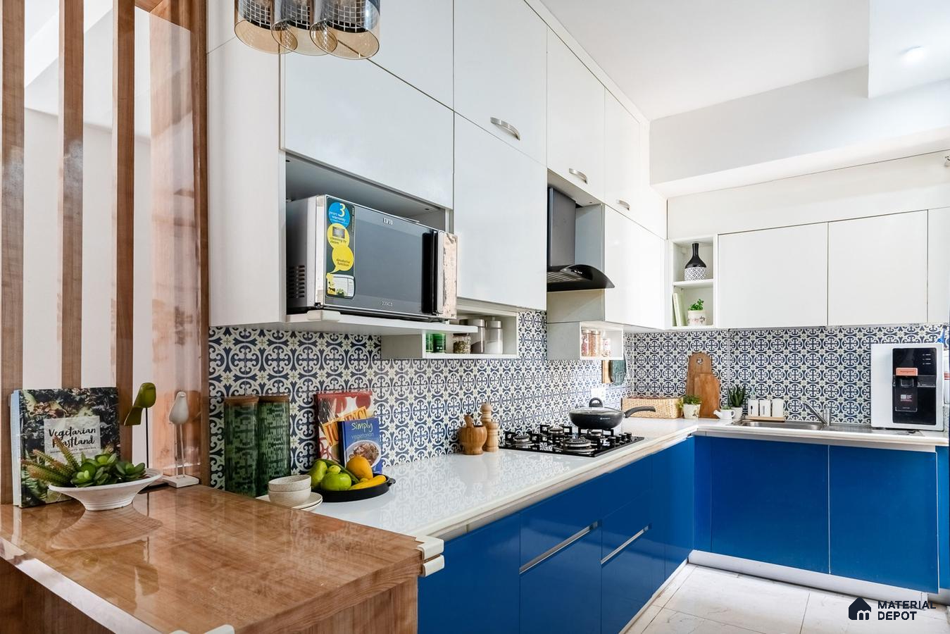 Modern dual tone kitchen with blue and white laminate, white quartz countertop, and blue patterned backsplash tiles in Bengaluru | Material Depot