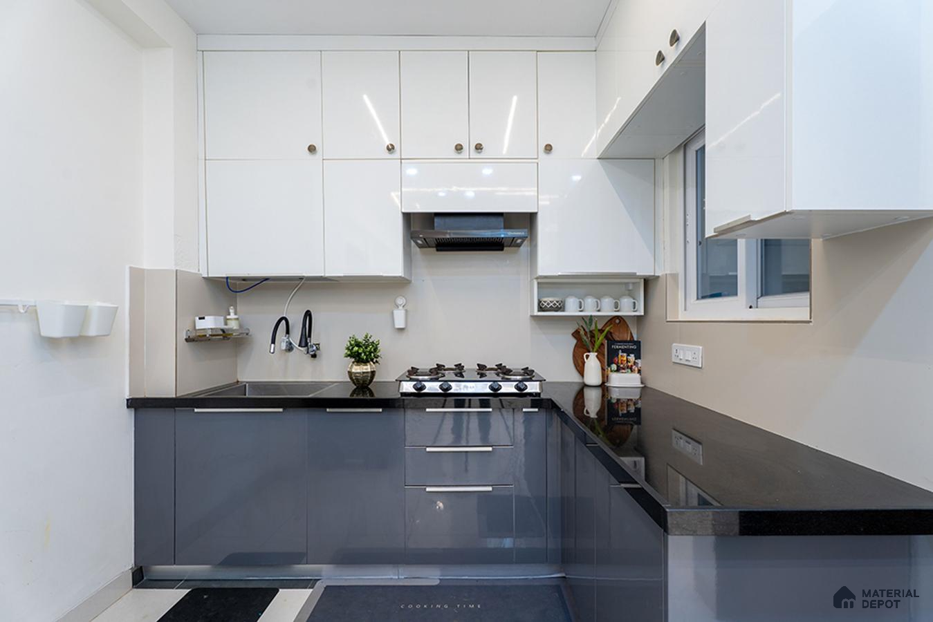 Modern dual tone kitchen with frosty white and grey high gloss laminate, black granite countertop in Bengaluru | Material Depot