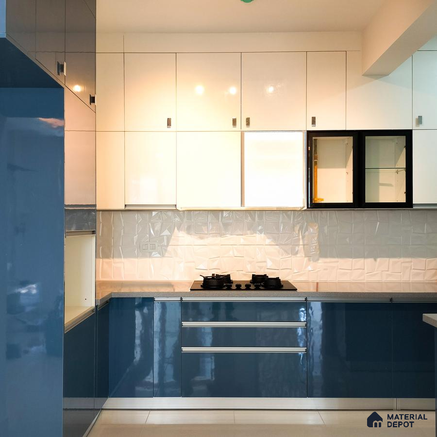 Modern dual tone kitchen with glossy blue and white laminate, geometric white backsplash tile, and quartz countertop in Bengaluru | Material Depot