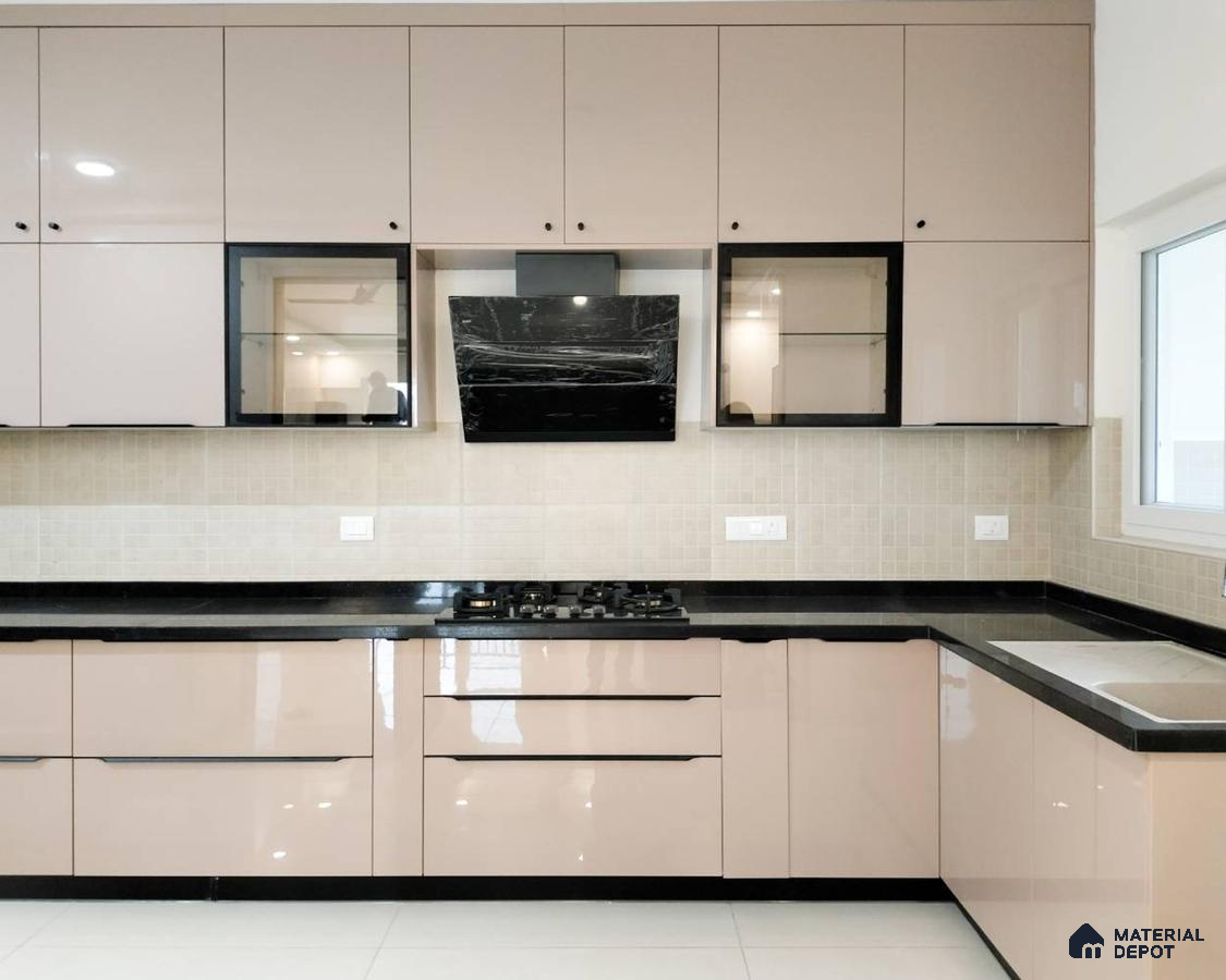 Modern kitchen with beige high gloss laminate cabinets, black granite countertop, and beige mosaic backsplash tiles in Bengaluru | Material Depot