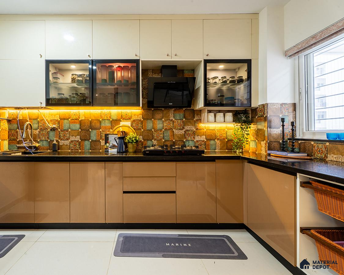Modern kitchen with beige high gloss laminate, patterned moroccan backsplash tiles, and black granite countertop in Bengaluru | Material Depot