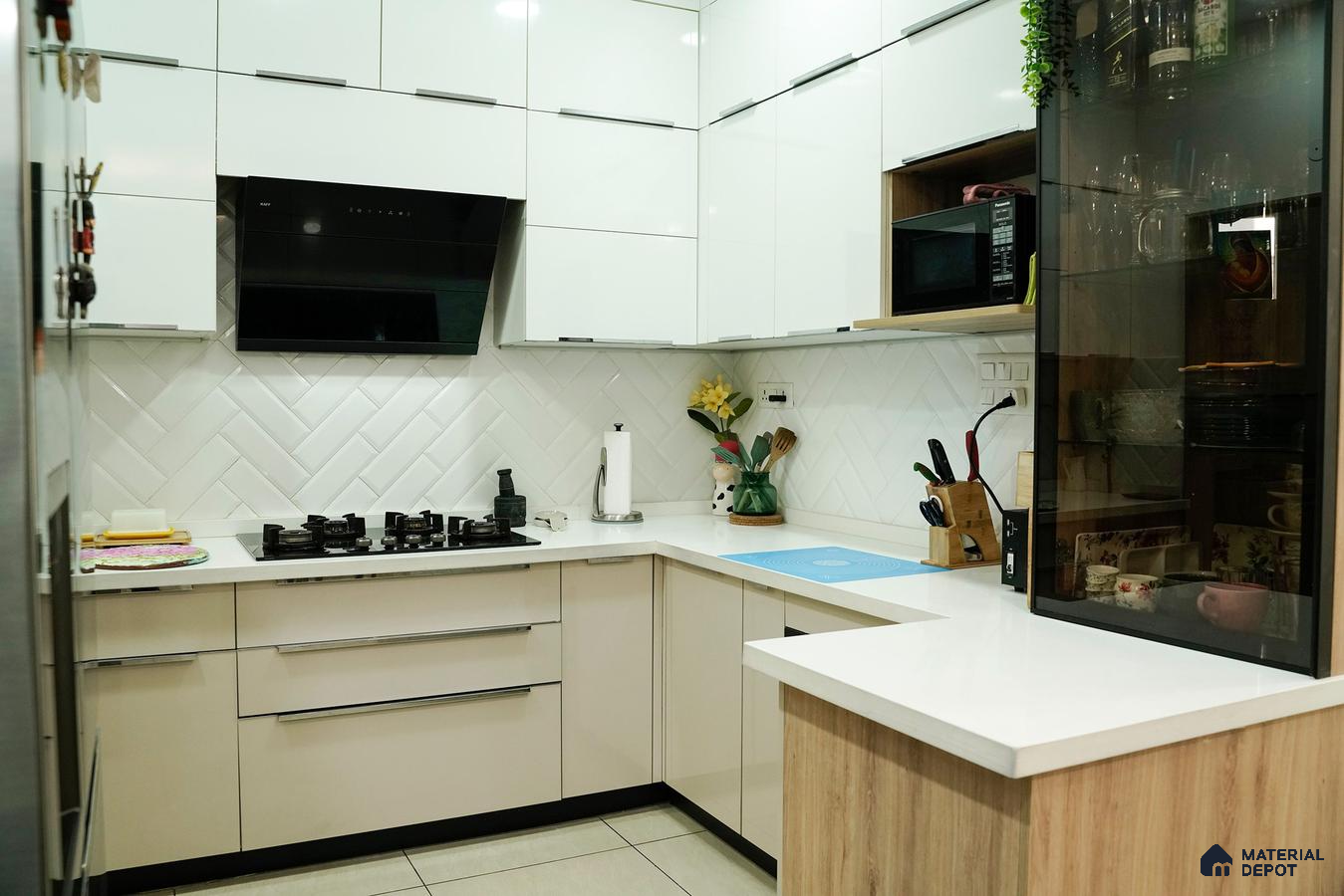 Modern kitchen with frosty white and beige laminate, white quartz countertop, and herringbone subway backsplash tile in Bengaluru | Material Depot