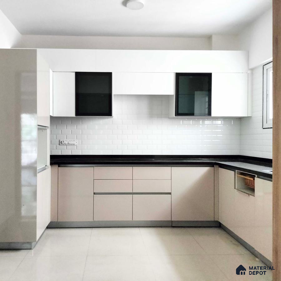 Modern kitchen with glossy beige laminate cabinets, black countertop, and white subway tile backsplash in Bengaluru | Material Depot