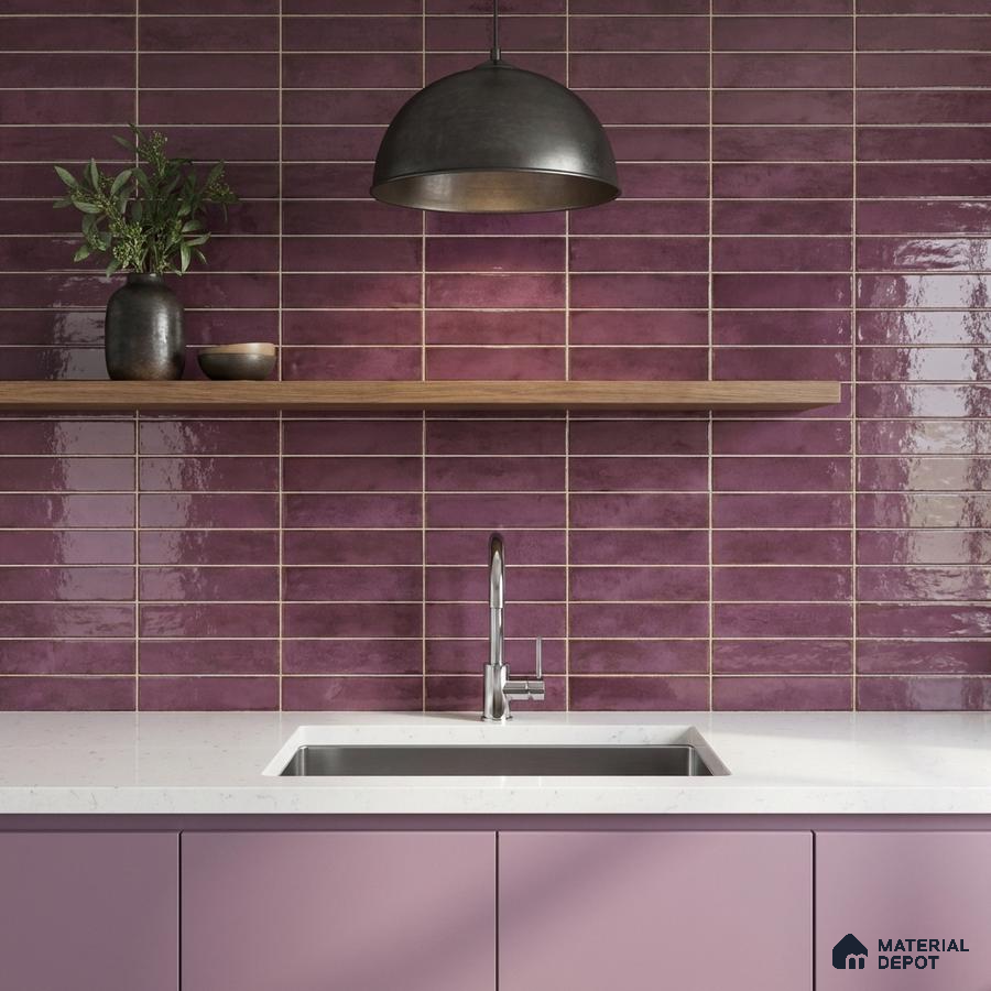 Modern kitchen with glossy plum subway wall tiles, pastel mauve laminate cabinets, and white quartz countertop