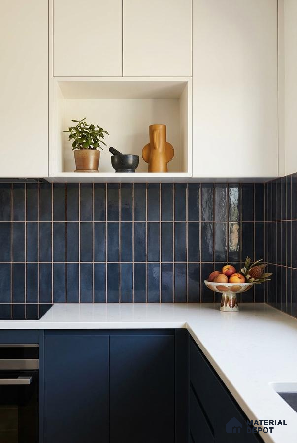Modern kitchen with navy blue vertical subway backsplash tile and white quartz countertop