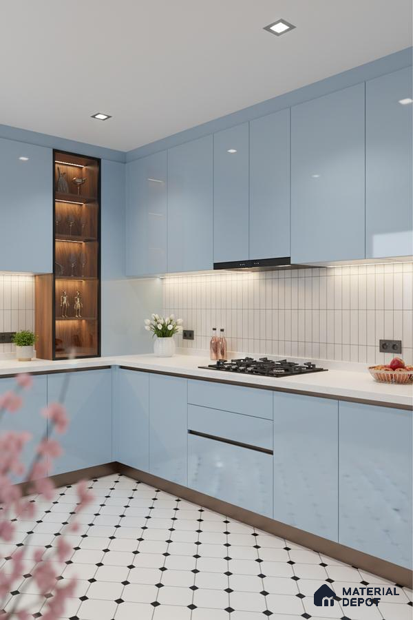 Modern kitchen with pastel blue high gloss laminate, white quartz countertop, and geometric patterned floor tiles in Bengaluru