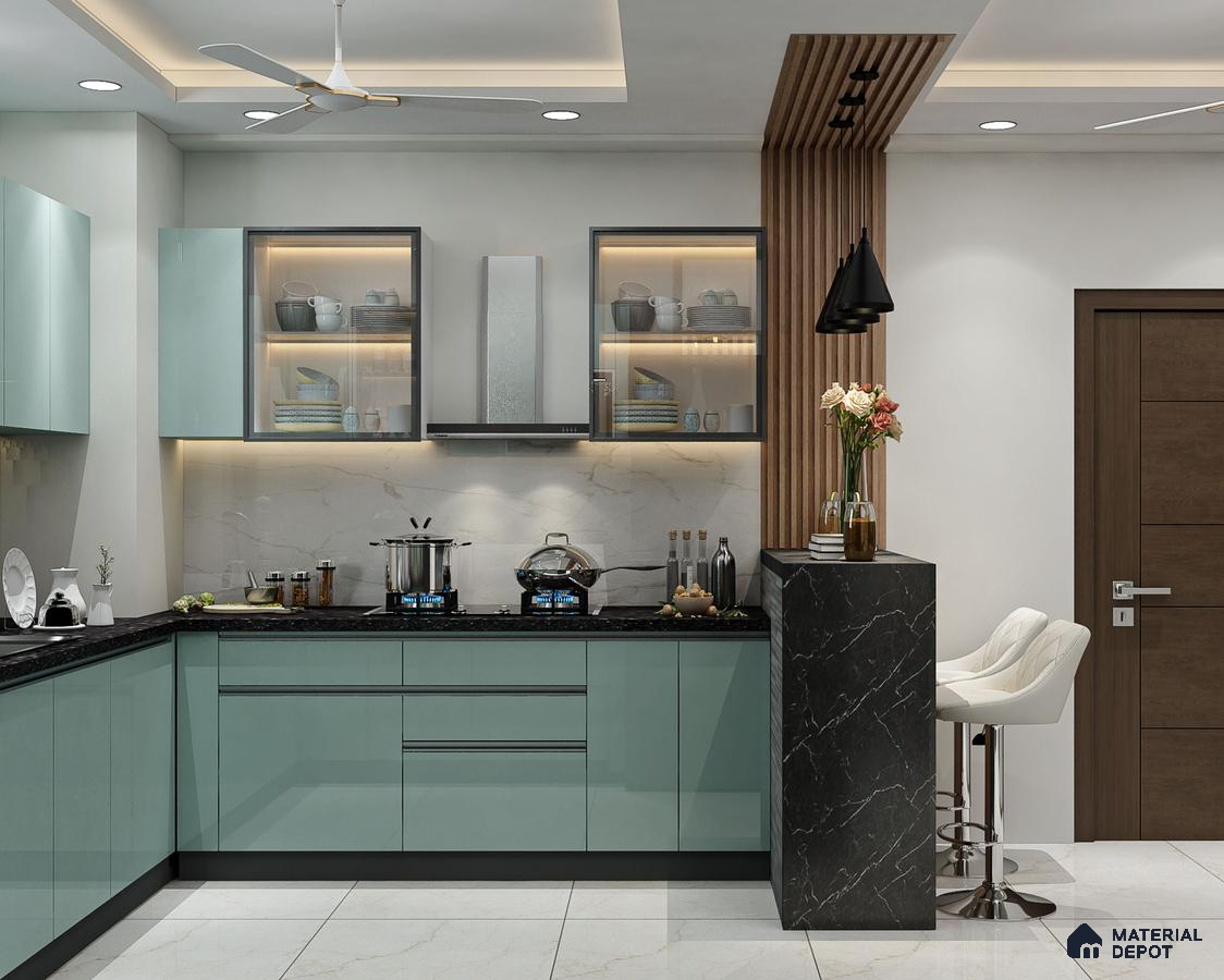 Modern kitchen with pastel green high gloss laminate, black marble breakfast counter, and marble backsplash in Bengaluru | Material Depot