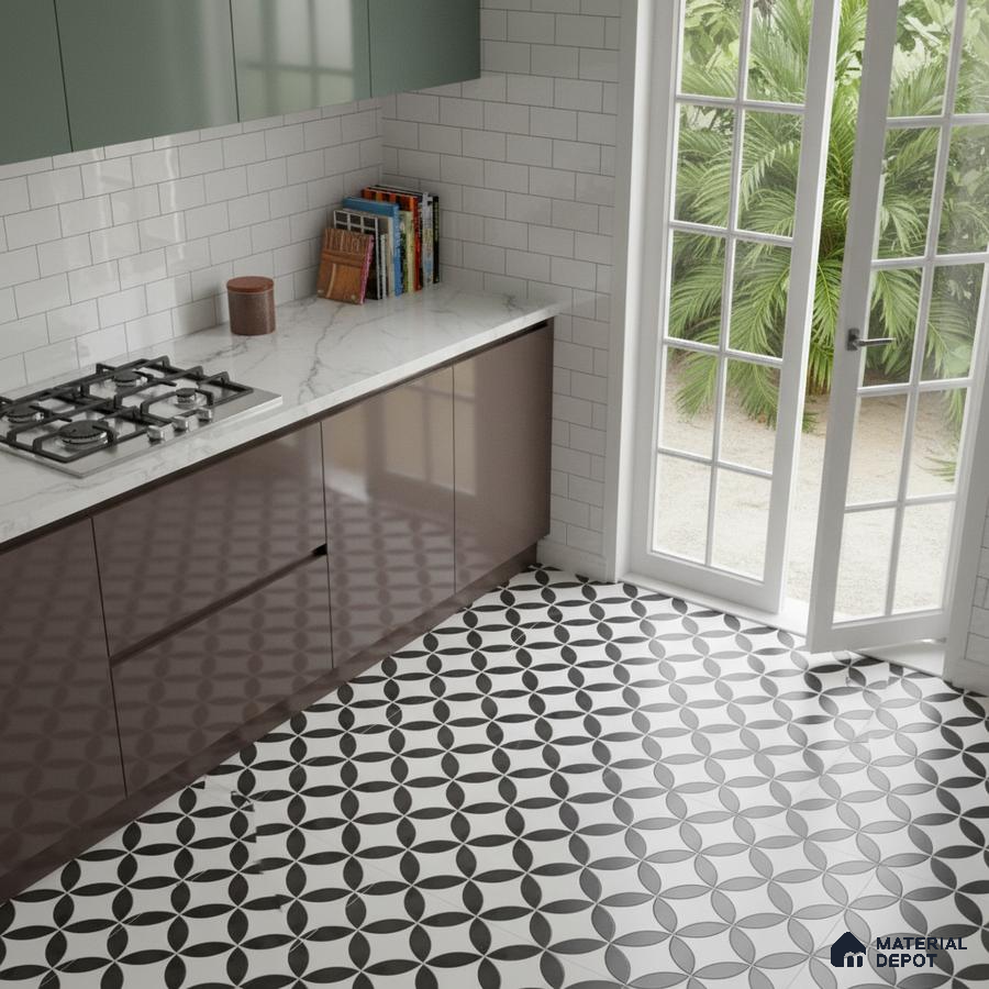 Modern kitchen with sage green and brown laminate, white marble countertop, and geometric black-and-white floor tiles in Bengaluru