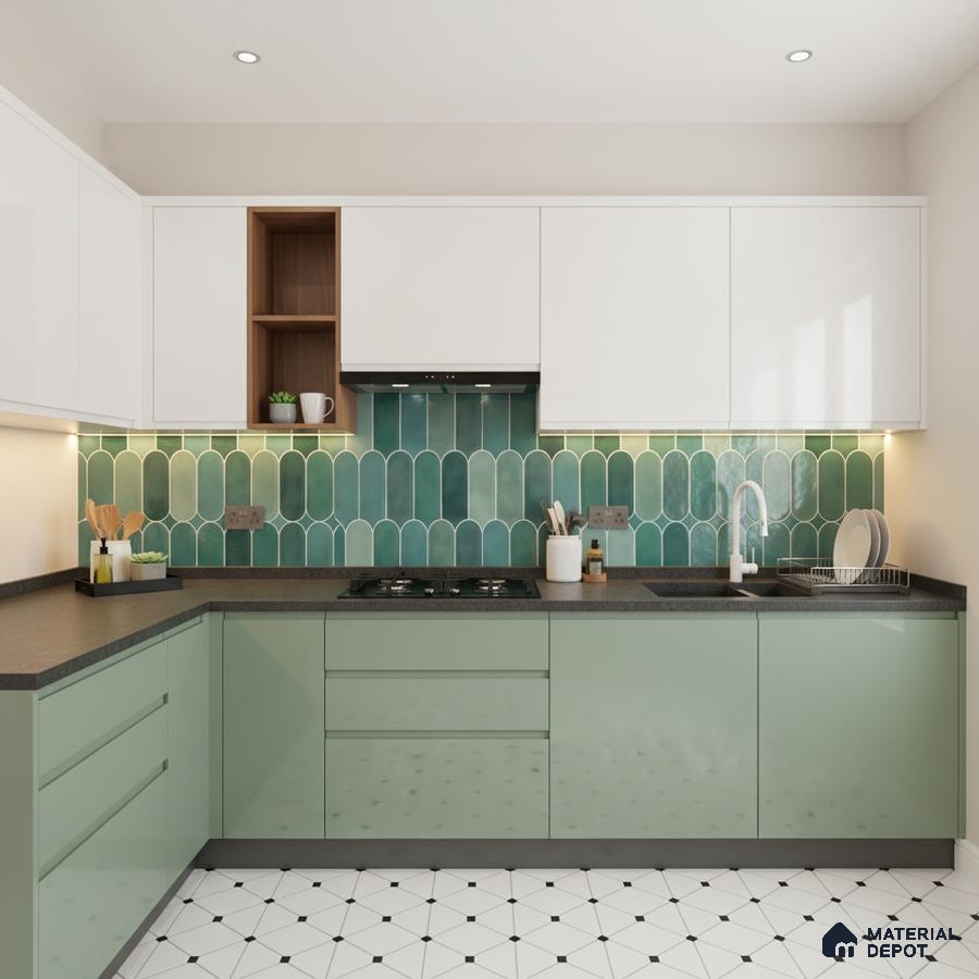 Modern kitchen with sage green laminate, white laminate, green picket backsplash tile, and black quartz countertop in Bengaluru