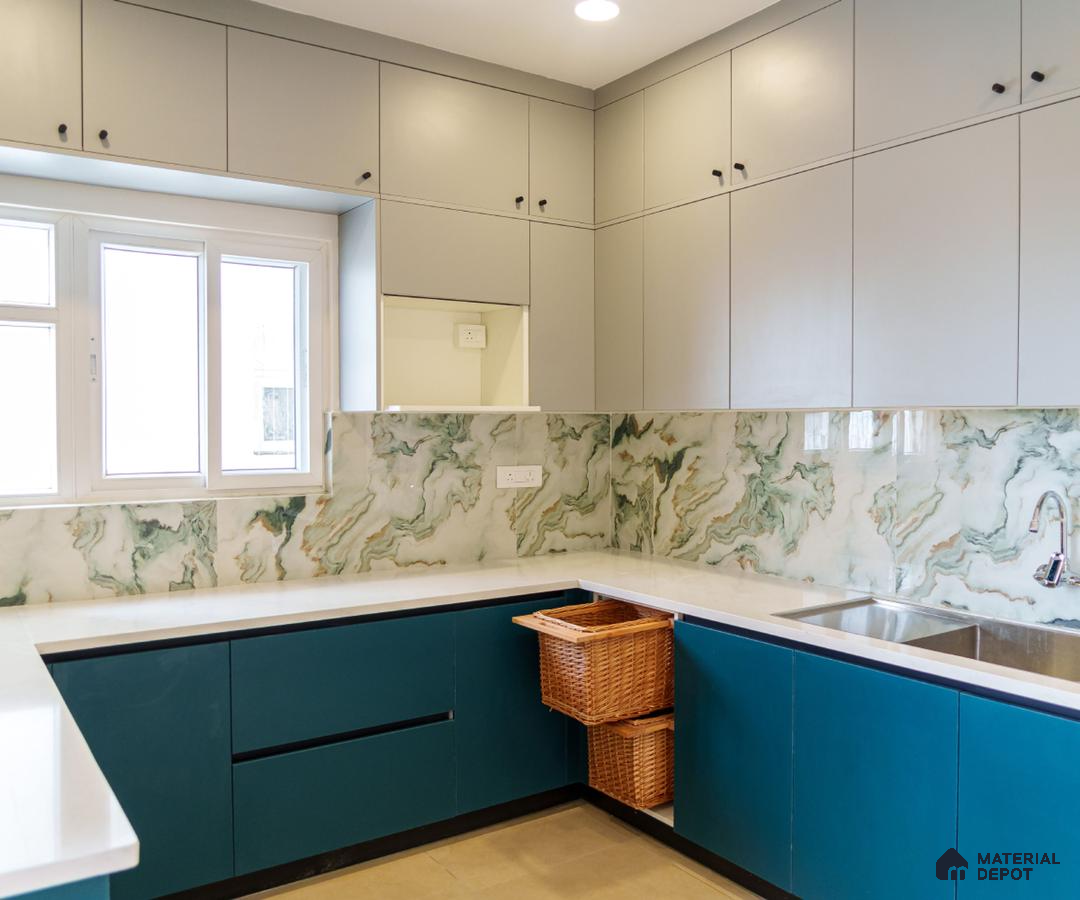 Modern kitchen with teal blue and light grey laminate, marble-look backsplash tile, and white quartz countertop in Bengaluru | Material Depot
