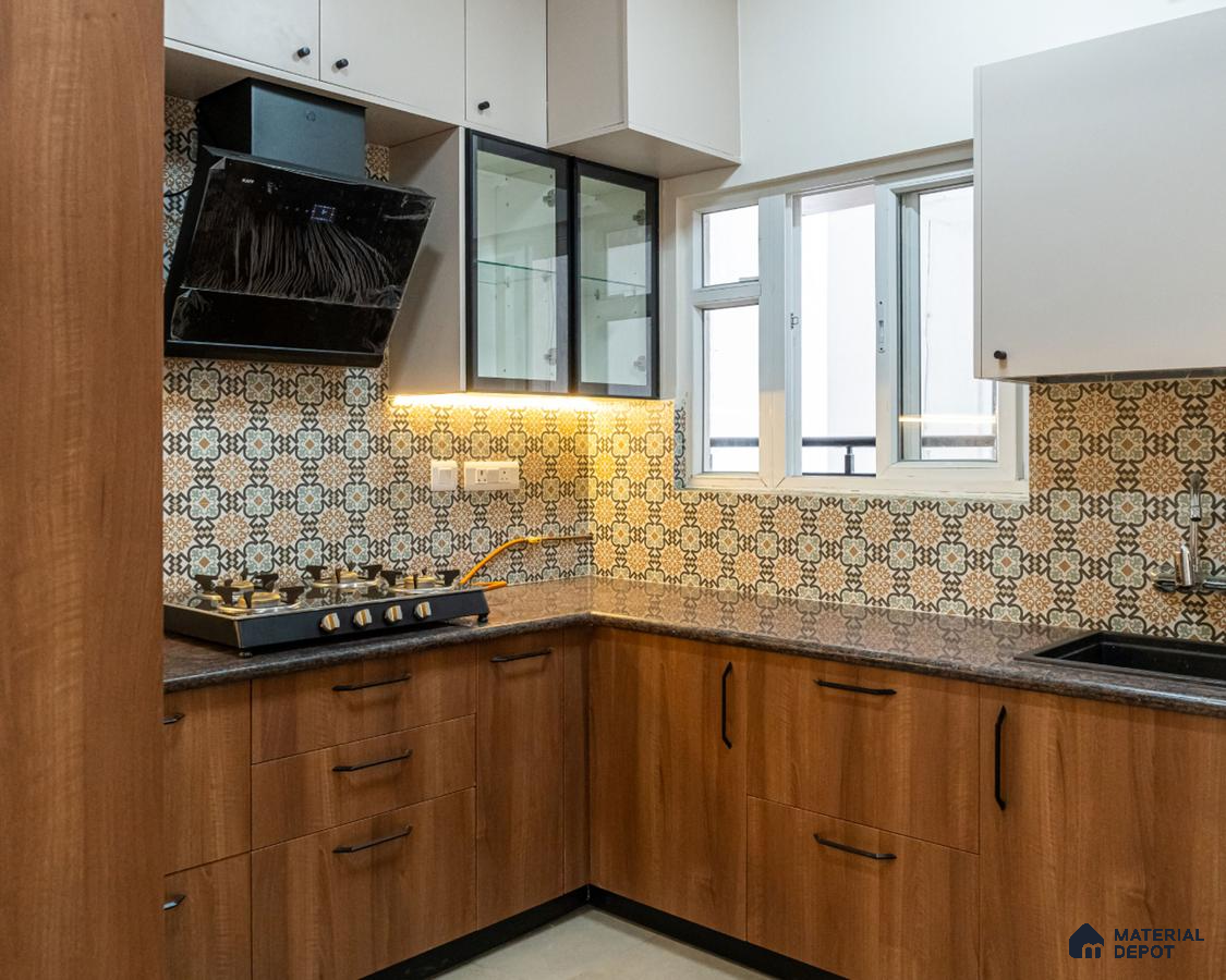 Modern kitchen with walnut brown wood laminate, patterned moroccan backsplash tiles, and dark granite countertop in Bengaluru | Material Depot