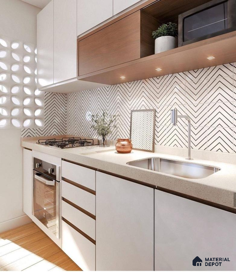 Modern kitchen with white laminate cabinets, beige quartz countertop, and chevron patterned backsplash tiles in Bengaluru | Material Depot