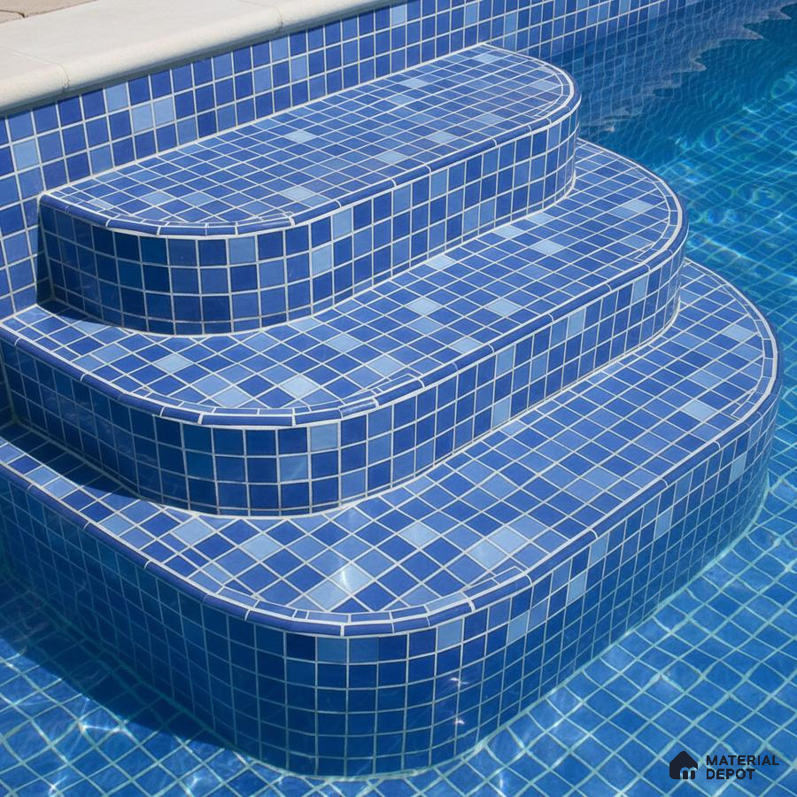 Modern outdoor pool with blue mosaic tiles on steps and walls