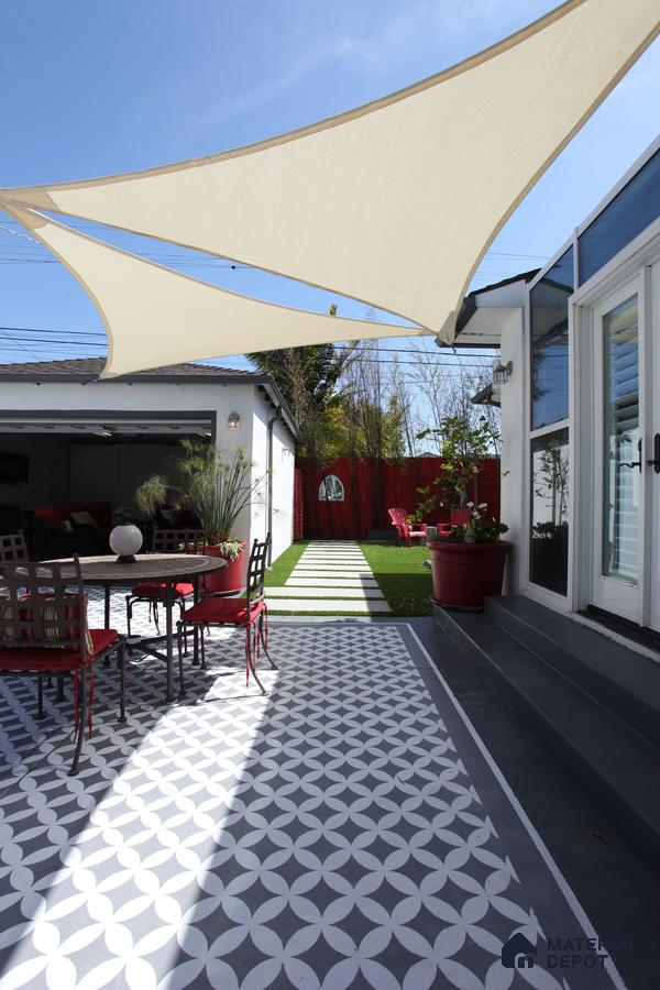 Modern Patio with Sun Shade Sail and Geometric Tile Pattern | Material Depot