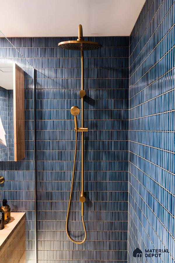 Modern Shower Area with Blue Vertical Tiles and Brass Fixtures | Material Depot
