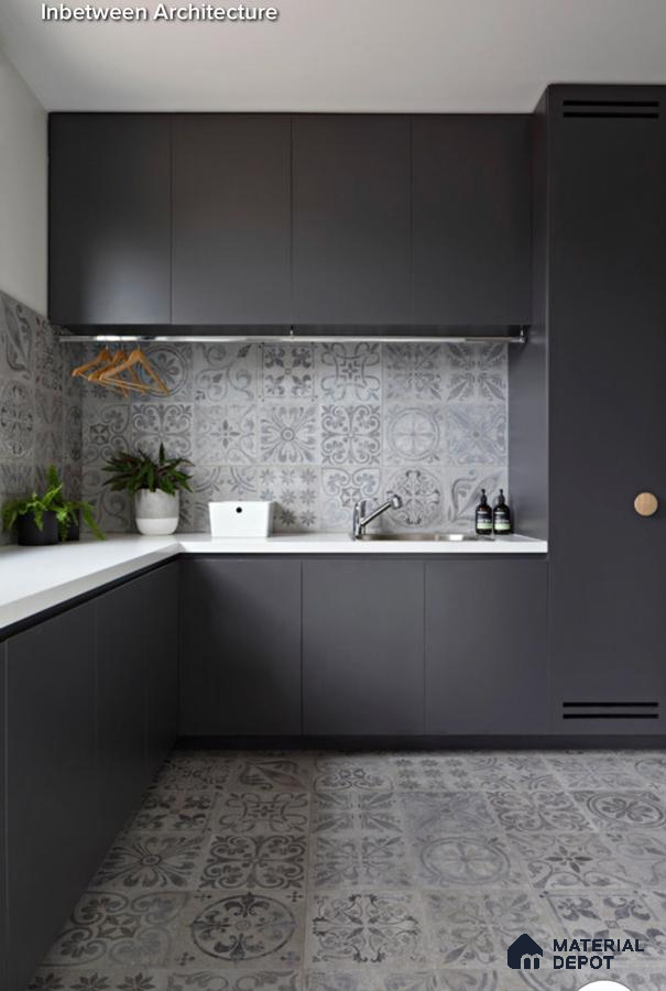 Modern utility room with matte charcoal laminate cabinets, white quartz countertop, and grey patterned moroccan tiles in Bengaluru | Material Depot