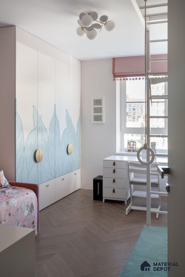 Scandinavian kids room with pastel blue leaf pattern wardrobe and herringbone wooden flooring | Material Depot
