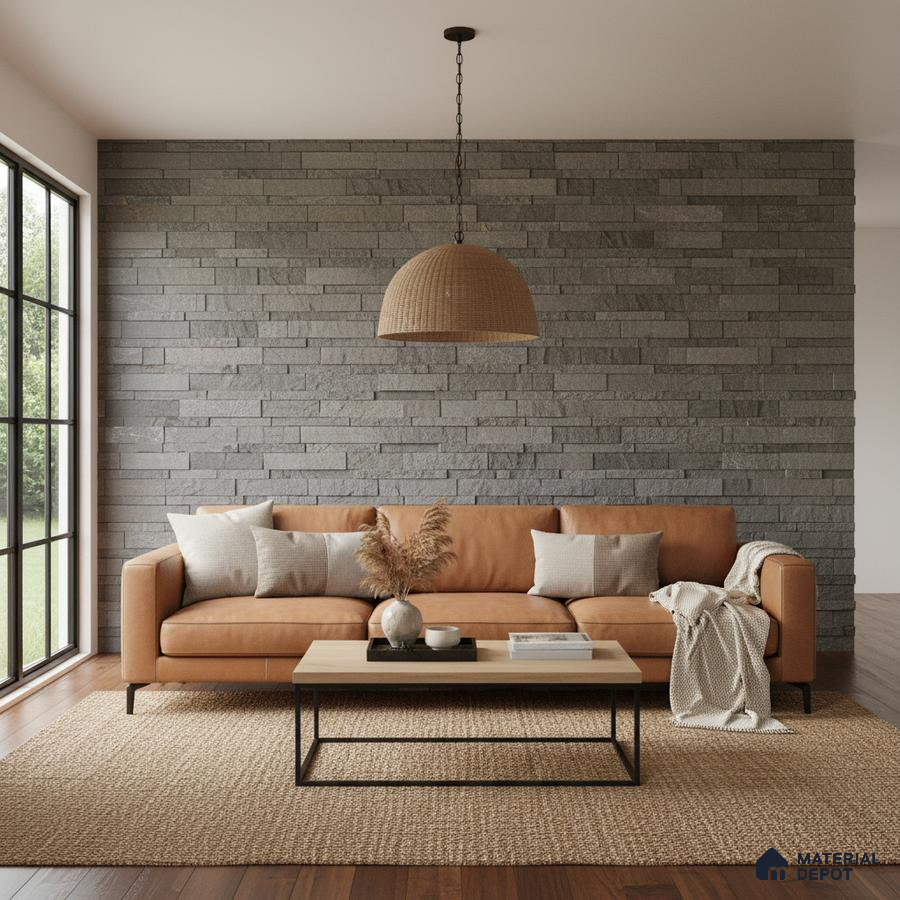 Scandinavian living room with grey stone cladding wall and tan leather sofa in Bengaluru