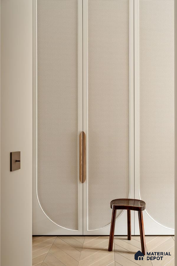 Scandinavian wardrobe with cane shutters, ivory laminate, and light oak chevron wooden flooring | Material Depot