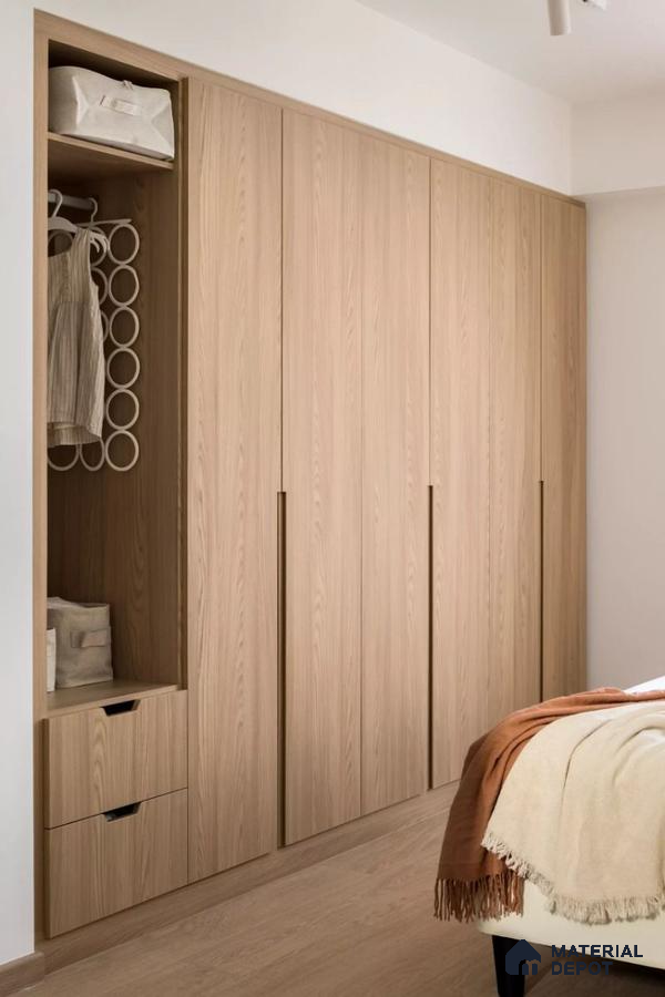 Scandinavian wardrobe with light oak wood laminate and minimalist built-in storage in bedroom | Material Depot