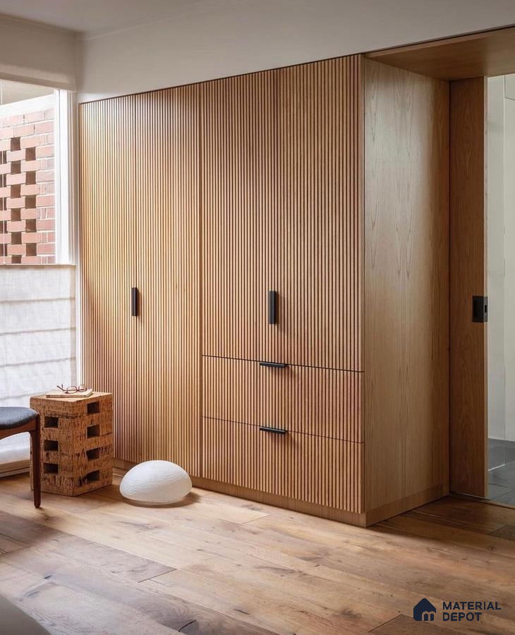 Scandinavian wardrobe with oak fluted laminate shutters and natural wood flooring | Material Depot