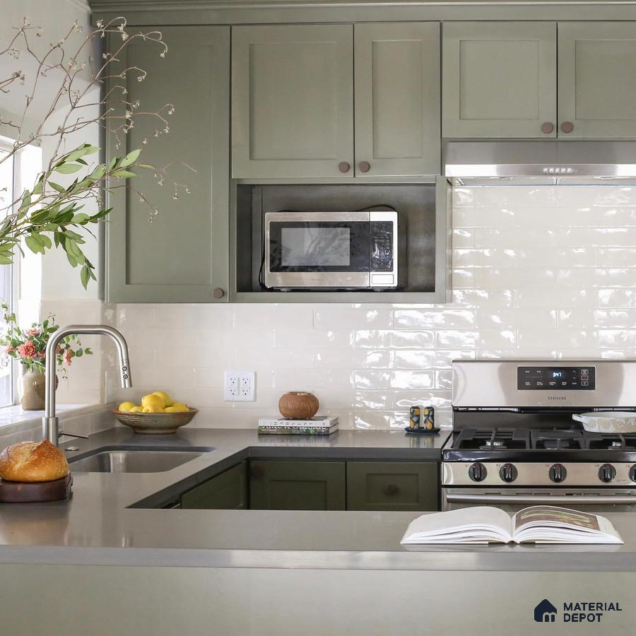 Kitchen unit with green laminate cabinet and faucet