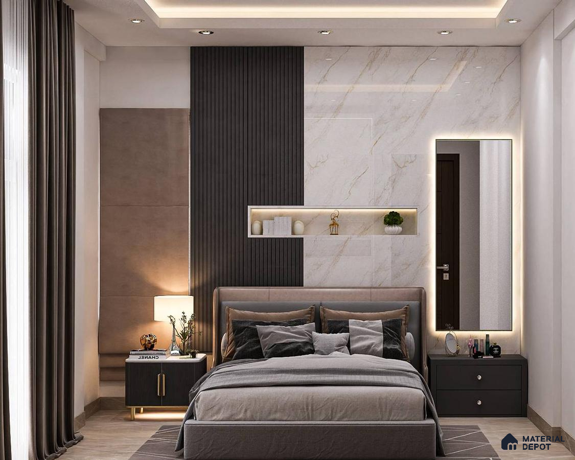A large bedroom with a marble wall, a bed with gray sheets, and wooden nightstands